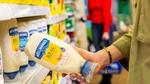 A women standing in a supermarket aisle holding some Hellmann’s ‘Real’ mayonnaise.