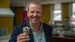 Matt Close, President of Unilever’s Ice Cream business group, smiling and holding a cornetto ice cream towards the camera